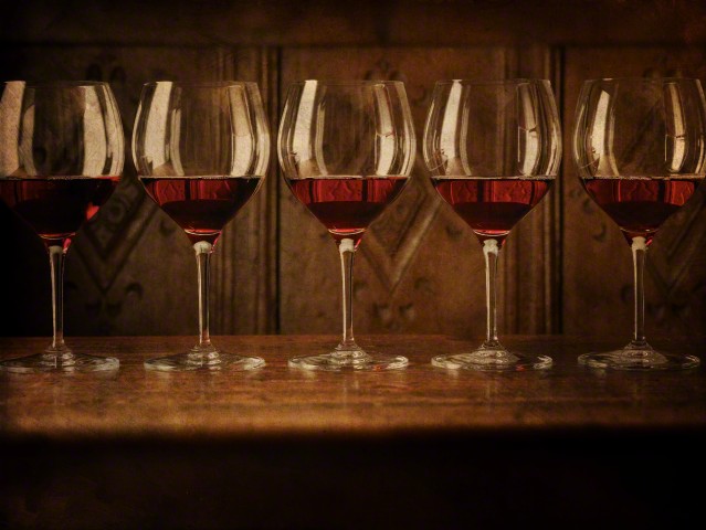 Glasses of red wine in a row